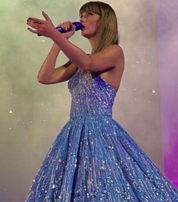 Taylor Swift wearing a blue dress