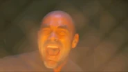 Dugan's final moments as he continues screaming in fear while the incinerator's flames deservedly and agonizingly cremate him alive as retribution for his history of committing and attempting to commit espionage throughout his life