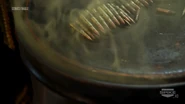 "Not hummus, this is gas" - One of the Al-Qaeda operatives being technically and partially right, but to be more exact, it's not just any gas, but a lethal combination of mustard and sarin gas as the contents spew out even more from the barrel