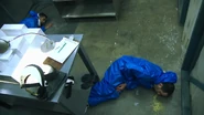 As soon as both men fall to the ground, even though they are wearing their blue hazmat radiation suits, it does not help as the massive surge of radiation from the Demon Core already overwhelmed them too greatly, causing them to be unconscious and start vomiting