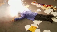 The resulting explosion that takes out and destroys Hadley's face, outright killing him