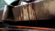 Blood dripping on the car crusher.