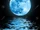 11772372-full-blue-moon-over-water-with-reflections.jpg