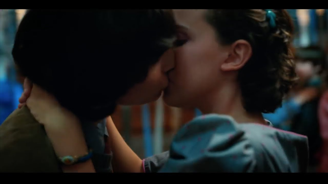 Mike and eleven kissing