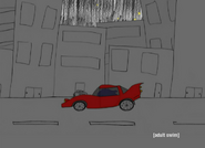 Shark drives alone in his car, while the Rectangular Businessman appears on a rocket seat in the air