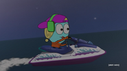 Kiki riding a jet-ski in the ocean