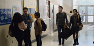 Tyler, and Cyrus walking down the hallway