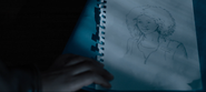 Ani finding a drawing of her