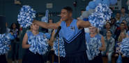 Marcus in a cheerleading uniform