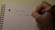 Hannah writing a letter for Zach