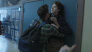 Monty pushing Tyler against the lockers