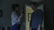 Jessica showing Bryce a gun