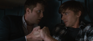 Charlie holding Alex’s hand as he’s having a panic attack