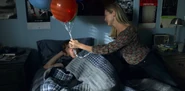 Alex's mother brings him a present.