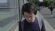 Clay listening to the tapes while walking to school