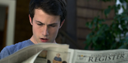 Clay looking at the newspaper