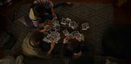 Sheri, Justin and Clay looking at the Polaroids