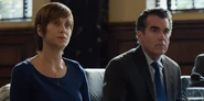 S02E05-The-Chalk-Machine-030-Olivia-Andrew.png (2.39 MB) Mr. and Mrs. Baker listening to Ryan's testimony