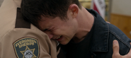 Clay crying in Sheriff Diaz’ arms