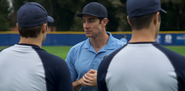 Coach Rick talking to the baseball players