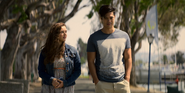 Hannah and Zach walking at the docks