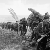 Royal Marine Commandos attached to 3rd Division move inland from Sword Beach on the Normandy coast, 6 June 1944. B5071.jpg (322 KB) Royal Marine Commandos attached to 3rd Infantry Division move inland from Sword Beach, 6 June 1944. An armoured bridge-layer tank is in the background. The UK helping to save Europe from genocidal Axis forces.