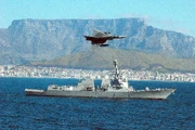 A Cheetah flying over USS Forrest Sherman in Table Bay.