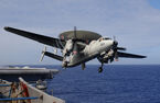 An E-2C Hawkeye assigned to the VAW-115 “Liberty Bells” is taking off from USS Kitty Hawk (CV-63) (2004). US Navy Grumman E-2C Hawkeye carrier based AEW&C.