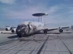 Fire-damaged USAF E-3 on Nellis AFB ramp.