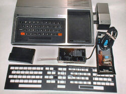 1979 TI-99-4 with Speech Synthesizer, RF modulator, keyboard overlays (adjusted)