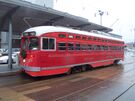 San Francisco Municipal Railway #1061, a rebuilt PCC streetcar painted in honor of the Pacific Electric Railway, is seen in service on the F Market heritage railway line in December, 2004. This single-ended car was originally built for the city of Philadelphia in 1946 (Pacific Electric only operated double-ended PCC's).