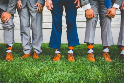 The men show off their socks.
