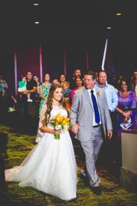 Joy walking down the aisle with Jim Bob.