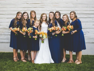 Joy and her sisters, serving as bridesmaids.