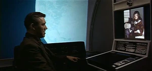Dr. Floyd uses a picturephone to call his daughter during his layover on Space Station V.