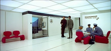 One of the many picturephone booths on Space Station V.