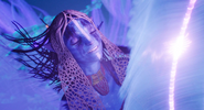 Neytiri connected to the Spirit Tree smiling.