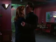 Tom hugs Linda and is protective.