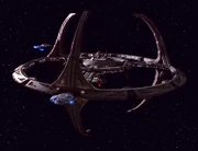 Deep Space 9. The  is docked with the station.