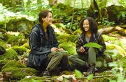 Rue and Katniss share a laugh while bonding in the arena.