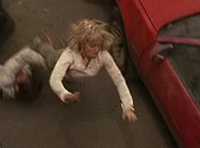 In Day 2: 9:00am-10:00am, she fought with Gary Matheson in the long shots of their fight between the cars.