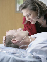 Taylor visits  at the hospital.