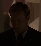 1x23 SS agent 2.jpg (16 KB) As hotel agent ("Day 1: 10:00pm-11:00pm")