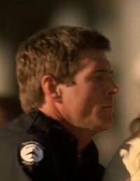 5x03 airport cop.jpg