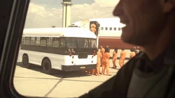 The prisoners are loaded onto a plane.