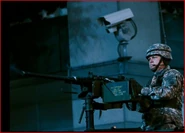 A soldier sshooting at District One civilians with a Browning M2HB.