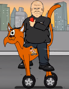 Mike Phelan riding the Orange Cat car.
