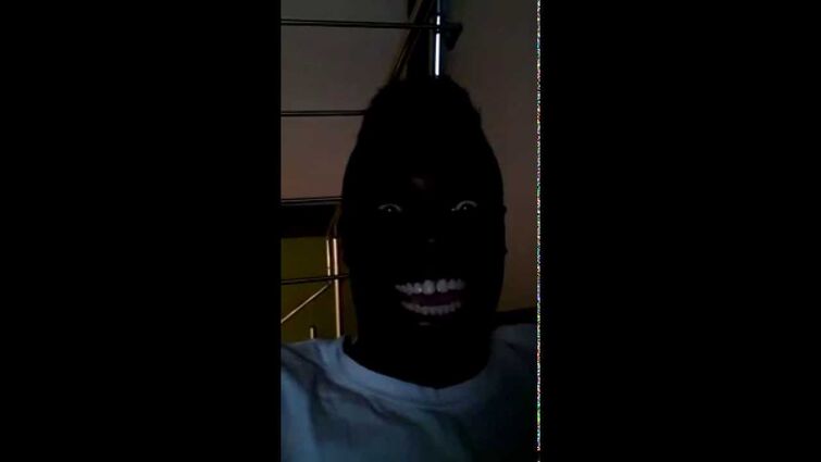 Black Man Laughing in the Dark