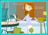 Jen noticing she was pranked with wet paint, as she looks at the green splat on her skirt.