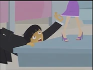 Robbie trying to peek up Jen's bridesmaid dress.